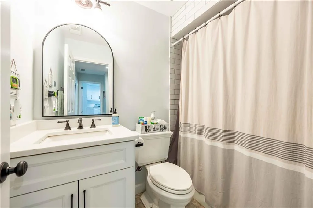 Bathroom featuring toilet and oversized vanity