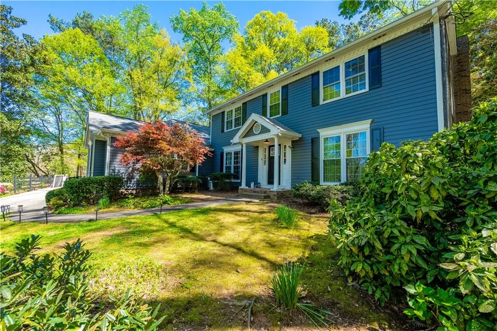 Colonial inspired home with a front lawn