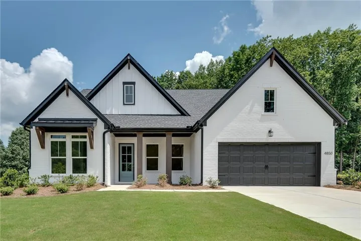 White brick exterior with dark trim accents
