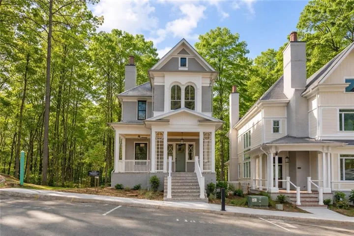 View of front of property with a porch and a chimney