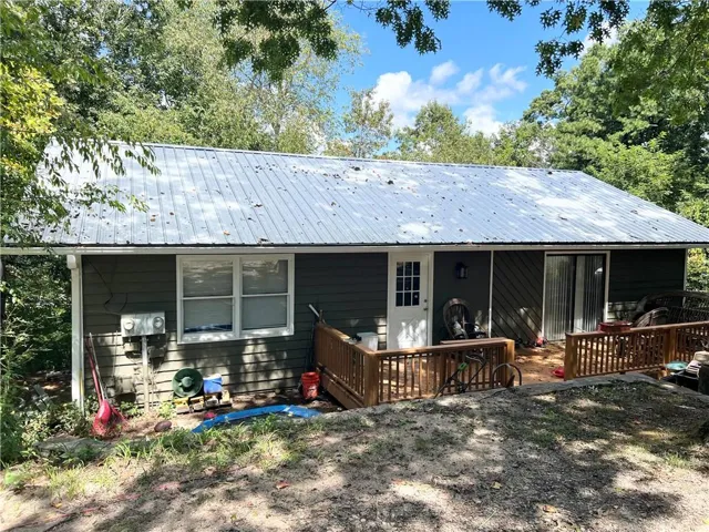 Back of property with a deck