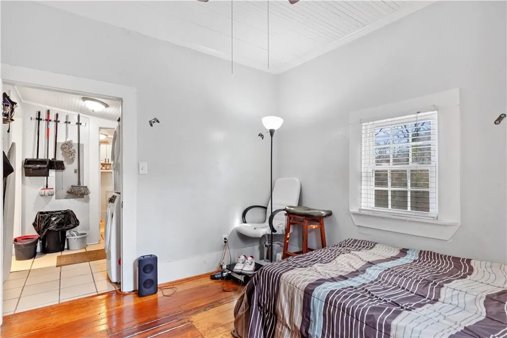 Bedroom featuring light hardwood / wood-style flooring and ornamental molding