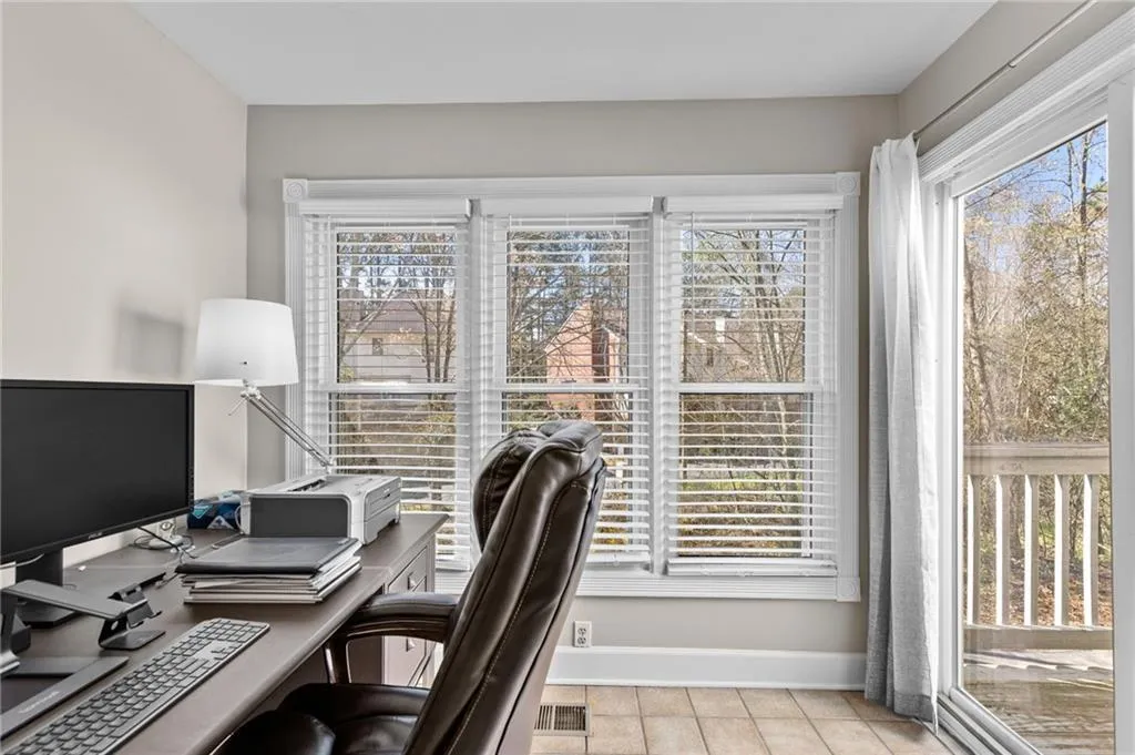 Office space featuring healthy amount of natural light and light tile patterned floors