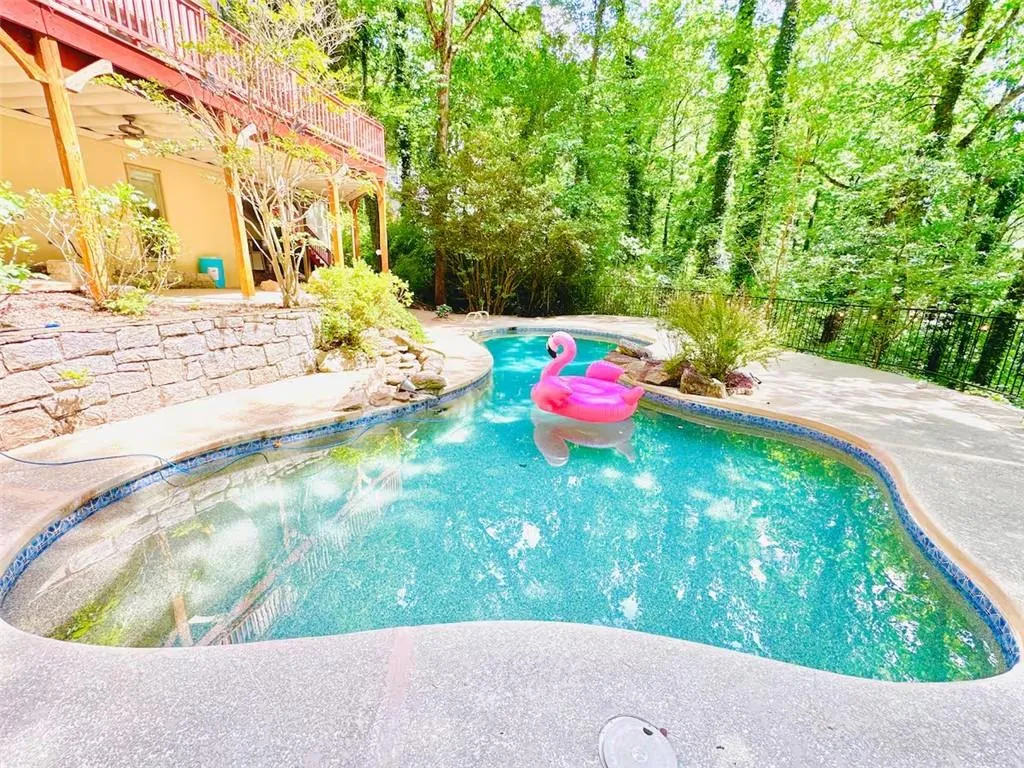 Swimming pool with a patio