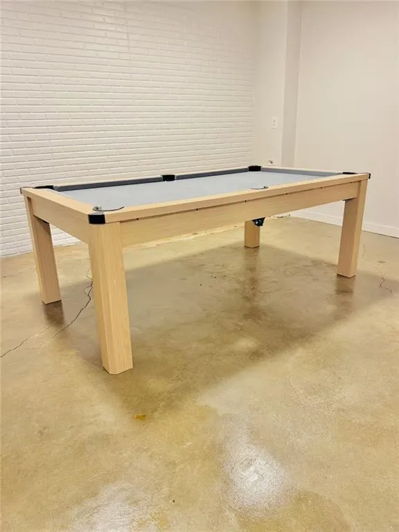 Rec room with concrete flooring and billiards table