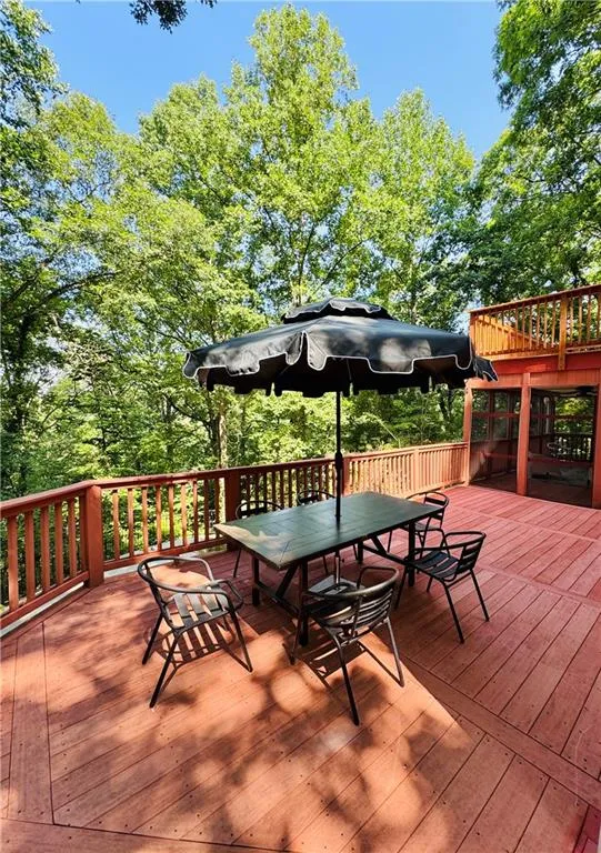 Wooden terrace featuring outdoor dining space