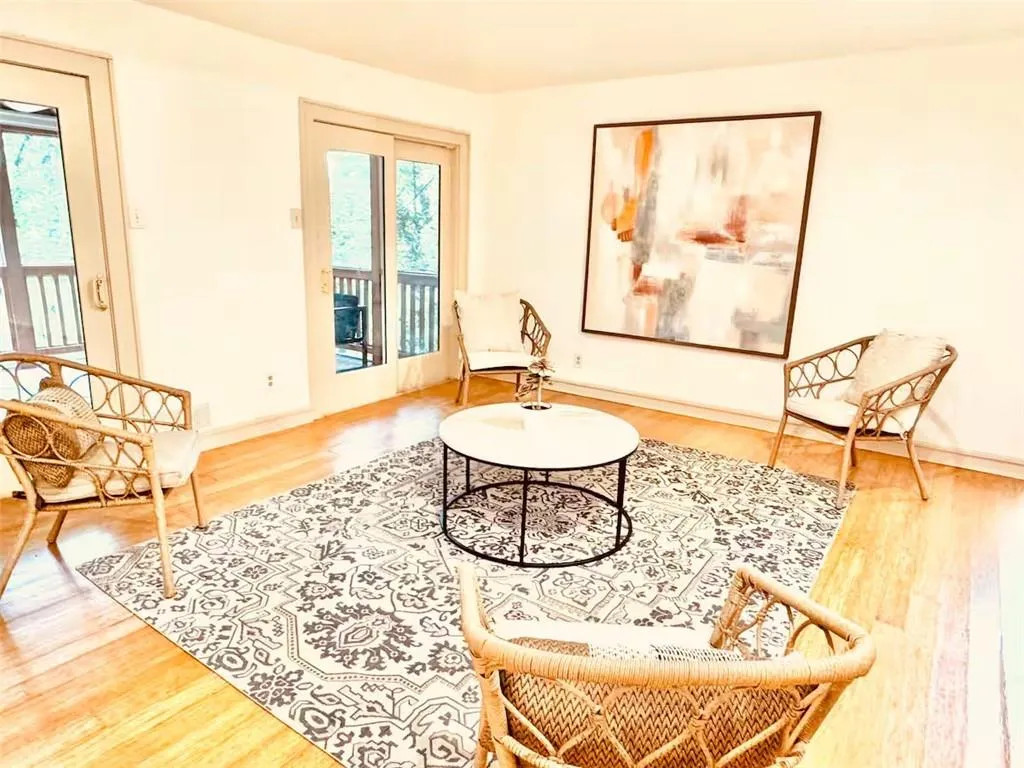 Sitting room featuring wood finished floors