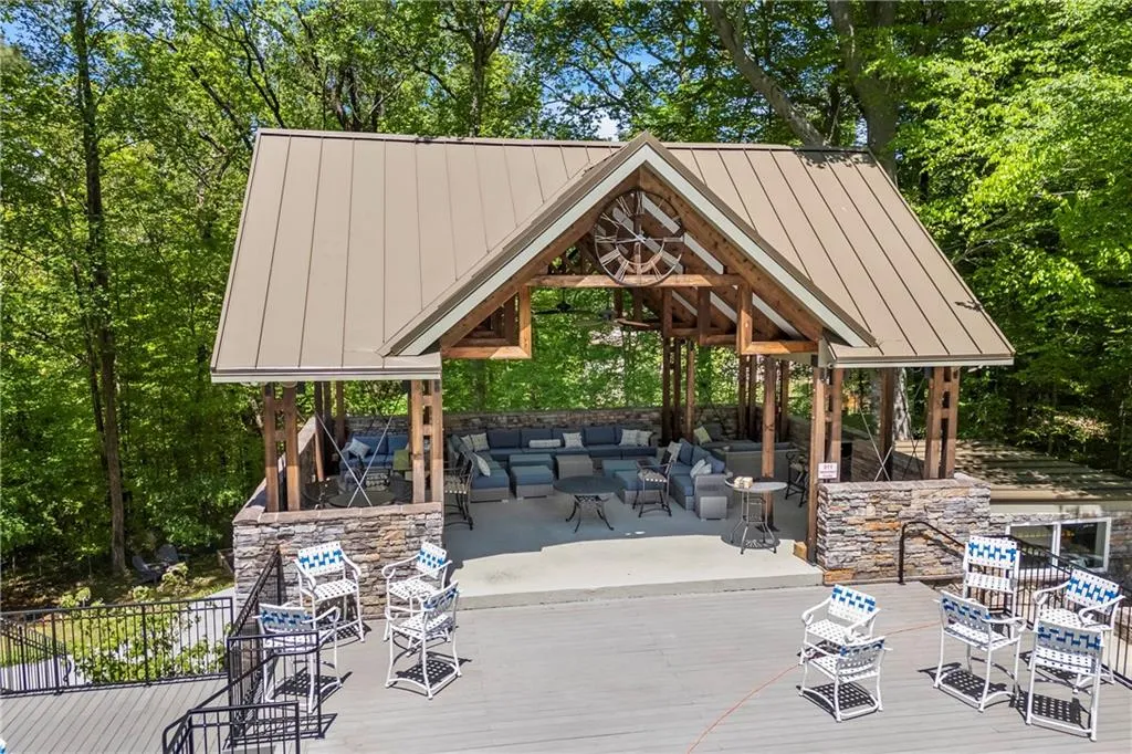 View of patio / terrace featuring a gazebo, outdoor lounge area, outdoor dining space, and a wooden deck