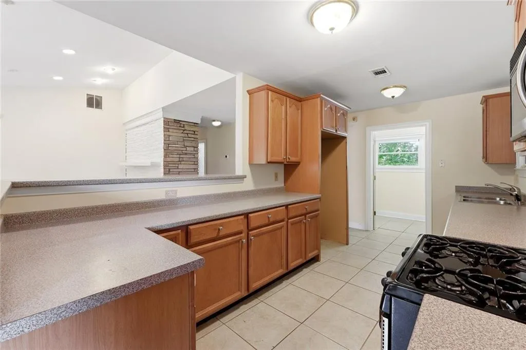 Open to living room, breakfast bar