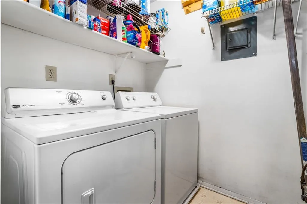 Laundry area with laundry area and separate washer and dryer
