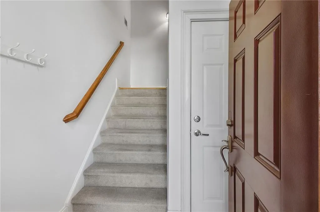 Entry with easy acces to garage or up to sunny living room