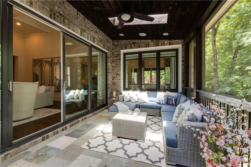Unfurnished sunroom featuring ceiling fan and wooden ceiling