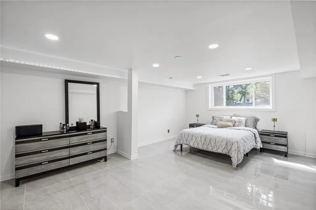 Bedroom with recessed lighting and light tile patterned floors
