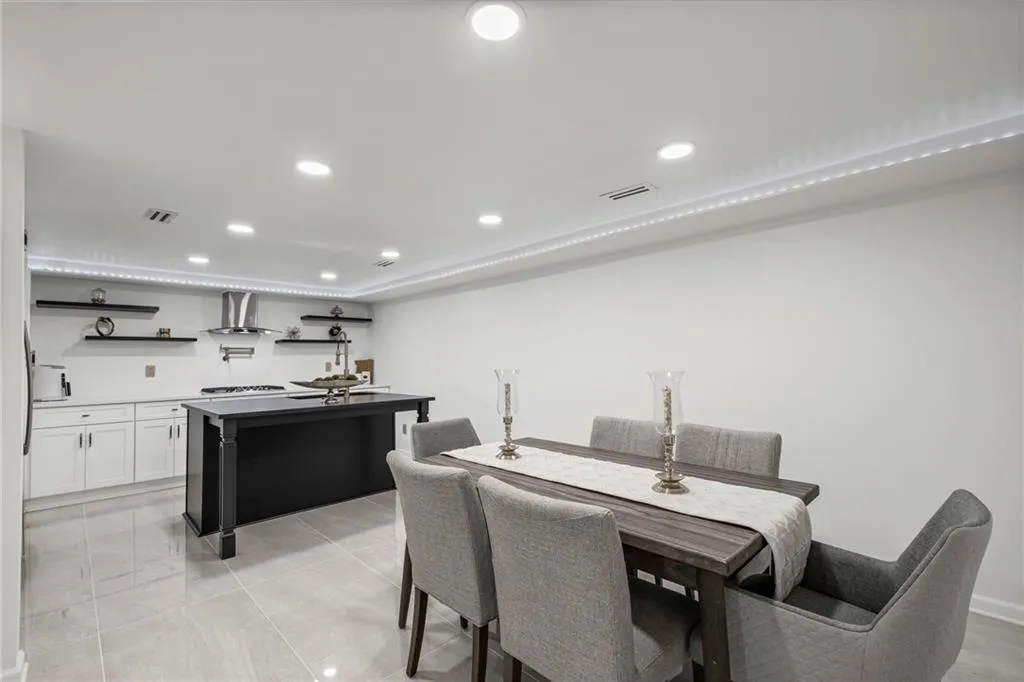 Dining room featuring recessed lighting and light tile patterned floors