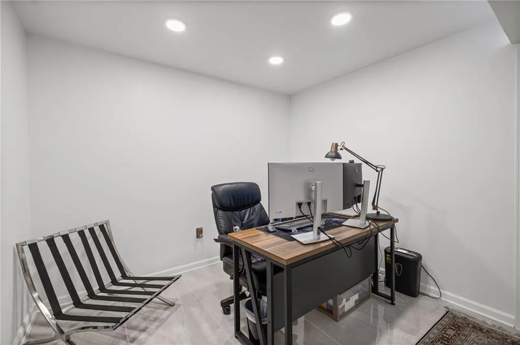 Office area featuring recessed lighting and light tile patterned flooring