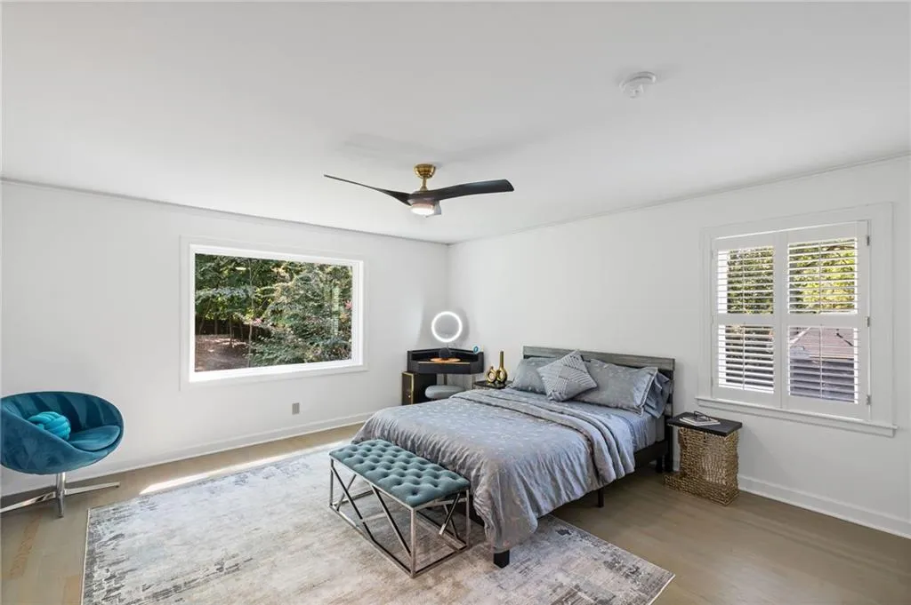 Bedroom featuring wood finished floors and a ceiling fan