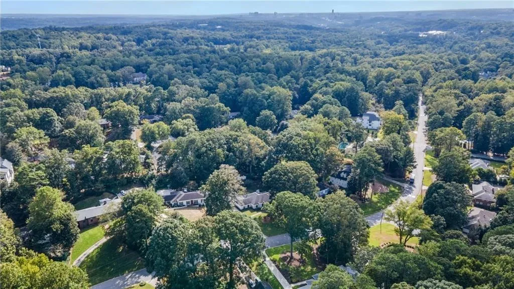 Aerial view of property's location featuring nearby suburban area