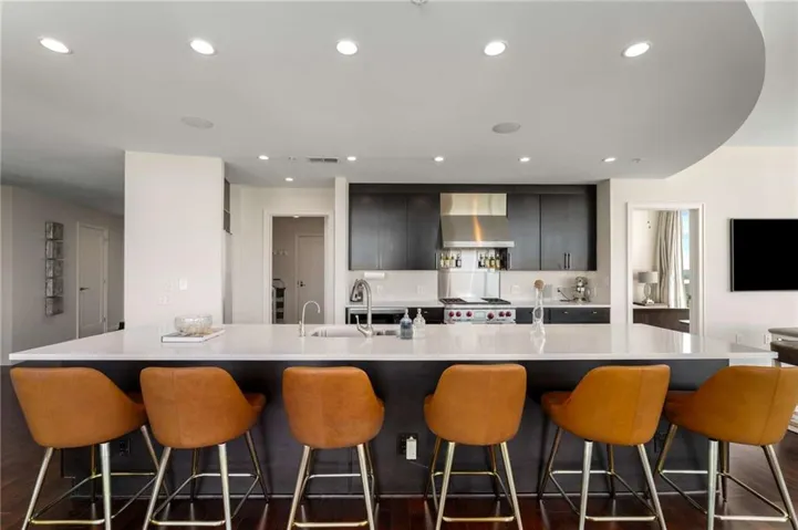 Introducing residence #2006 (end unit) at Terminus (private residential lobby). Terminus is a 32-story (137 residences) full-service building. This sleek ebony stained chef's kitchen is equipped with premium stainless appliances, warming drawer & long center island with an abundance of seating.