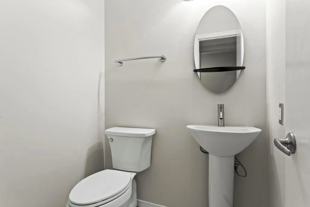 Main Floor Half Bath w/ Pedestal Sink