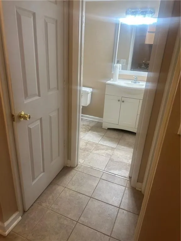 Bathroom with vanity and light tile patterned floors