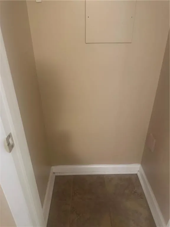 Laundry room featuring tile patterned floors