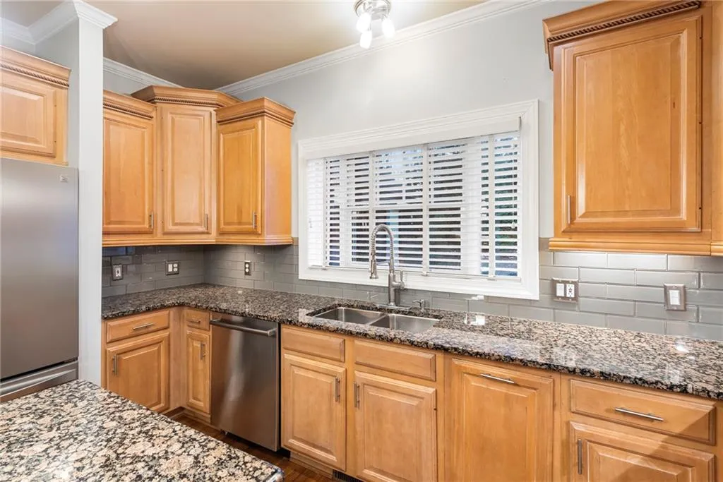 Picture window overlooks deep double sink