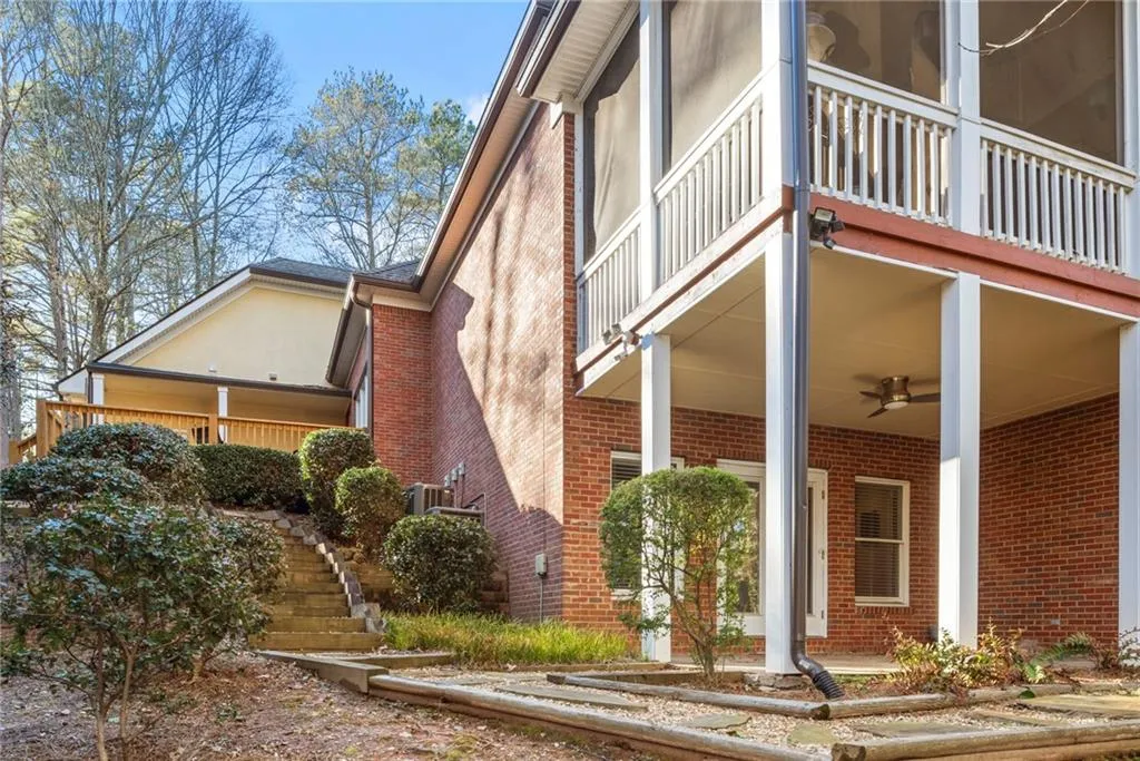 Below the main level screened porch is the terrae level covered patio.