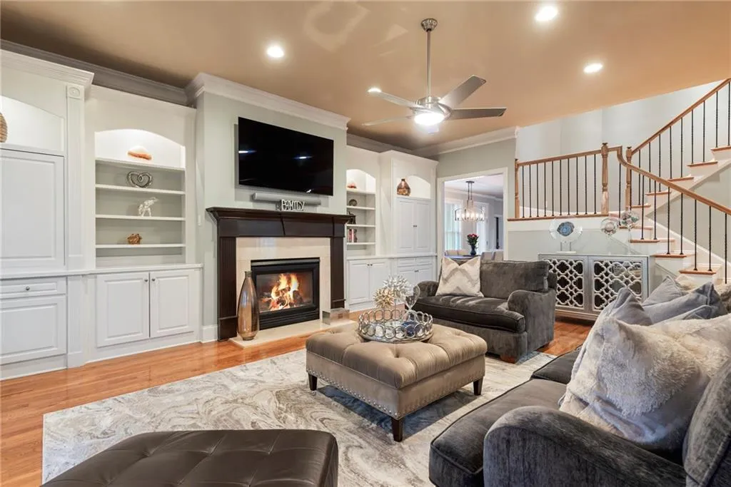 Spacious living room with gas fireplace, stairs to the upper bedrooms