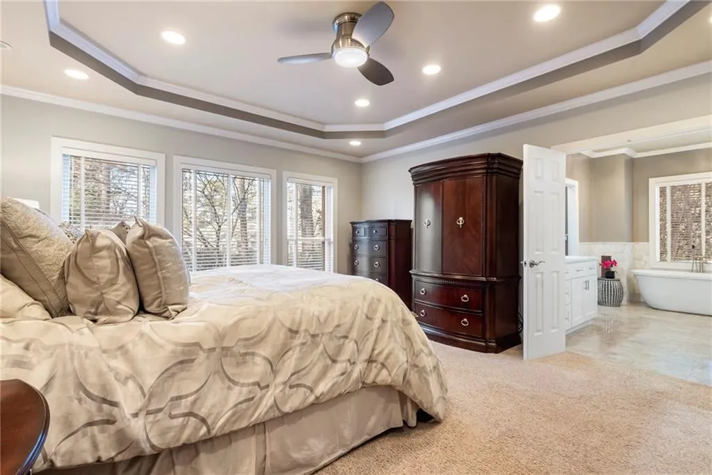 Enter the Primary Bedroom on the Main level