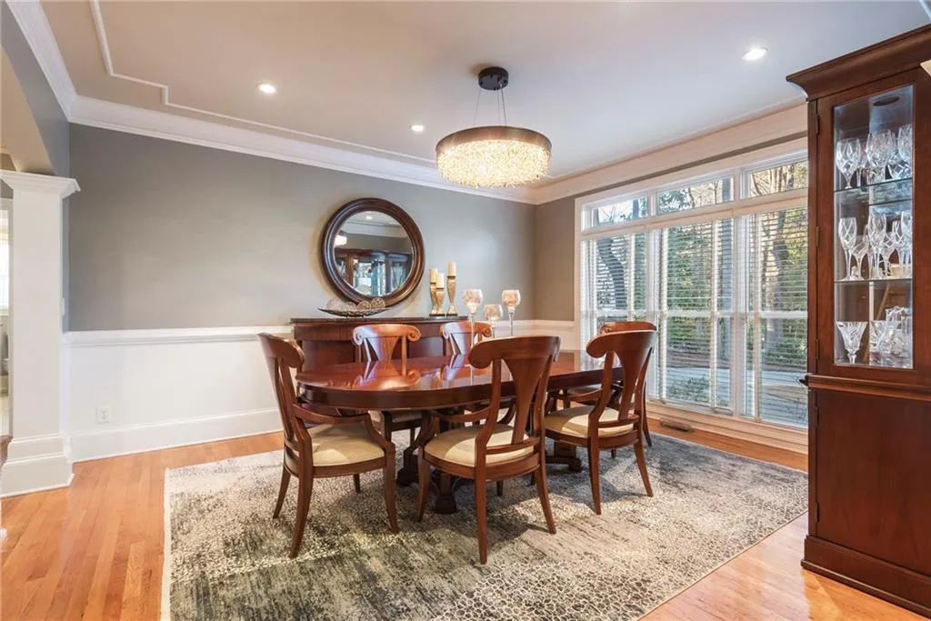Formal dining room with large picture window.