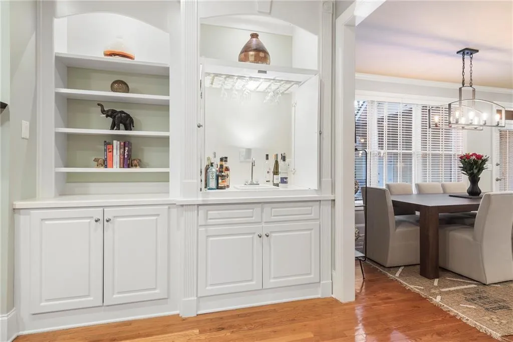 behind the pocket doors in the built-in cabinetry is a hidden wet bar - great for entertaining!!