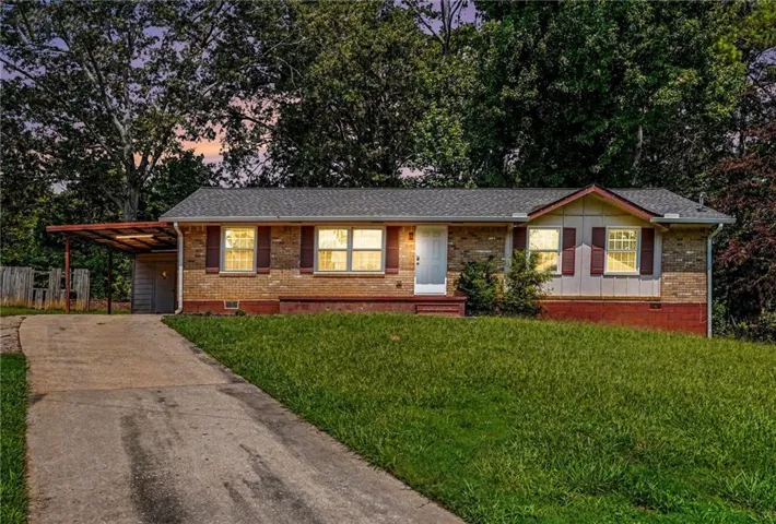 Brick exterior with a gabled roof and white trim