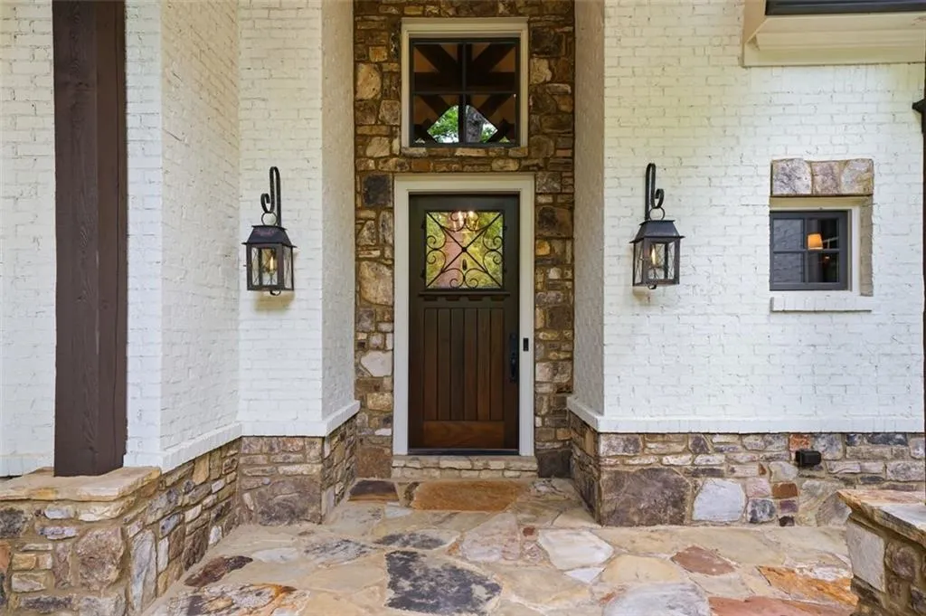 Front Porch Entry featuring gas lamps