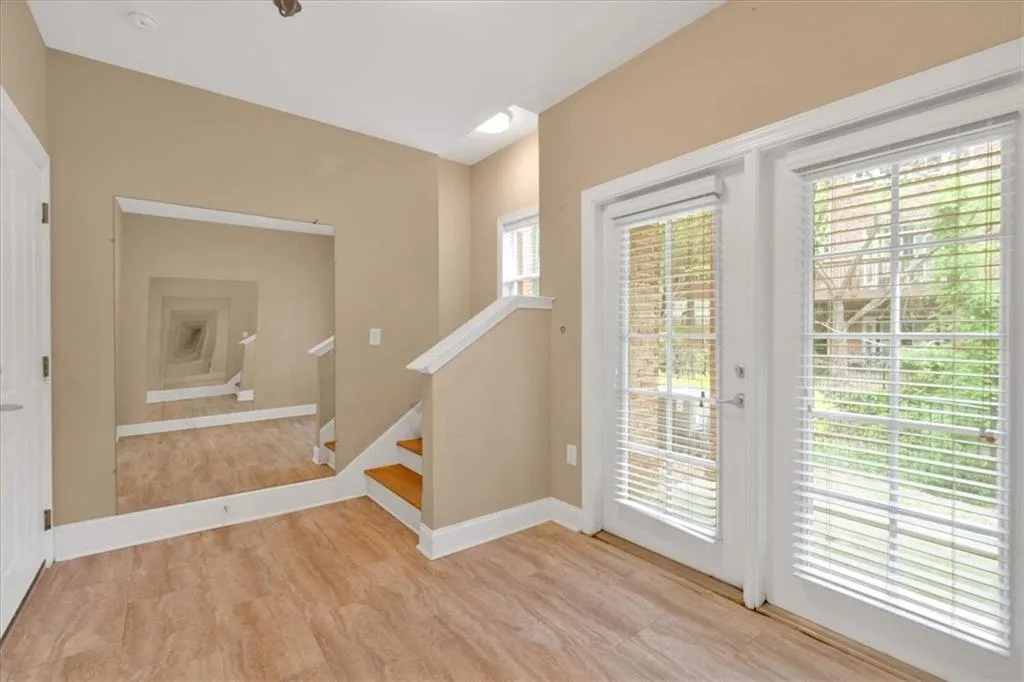 Doorway featuring baseboards and stairs