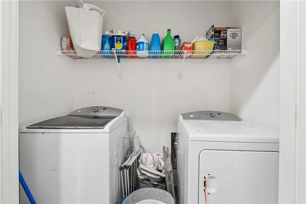 Laundry area with washer and clothes dryer