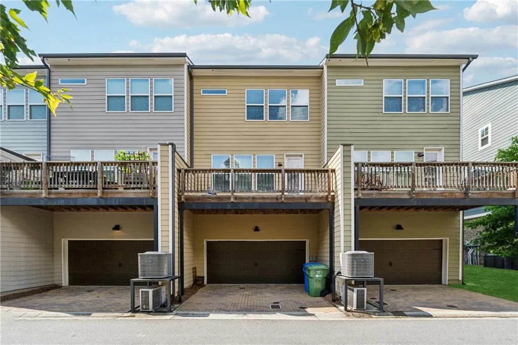 Rear view of property with an attached garage