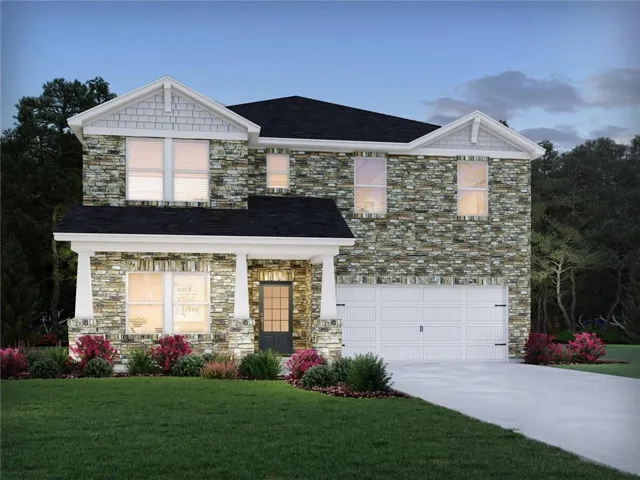 Stone and brick exterior with white trim and gable detailing, featuring a two-story elevation with multiple windows allowing natural light throughout
