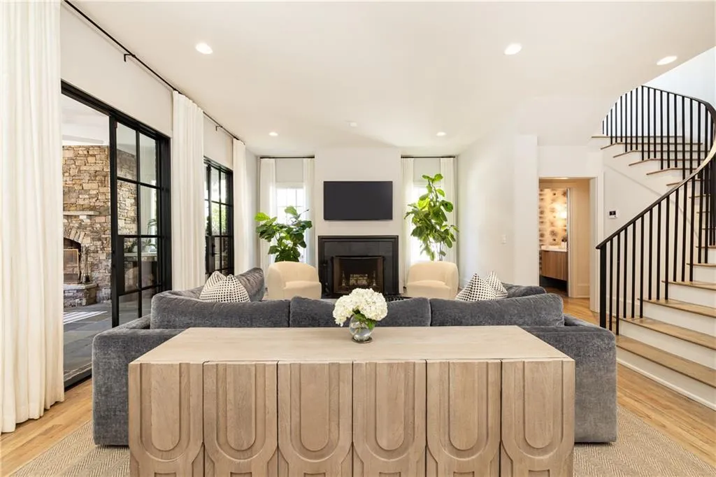 Open family room with fireplace and elegant architectural details