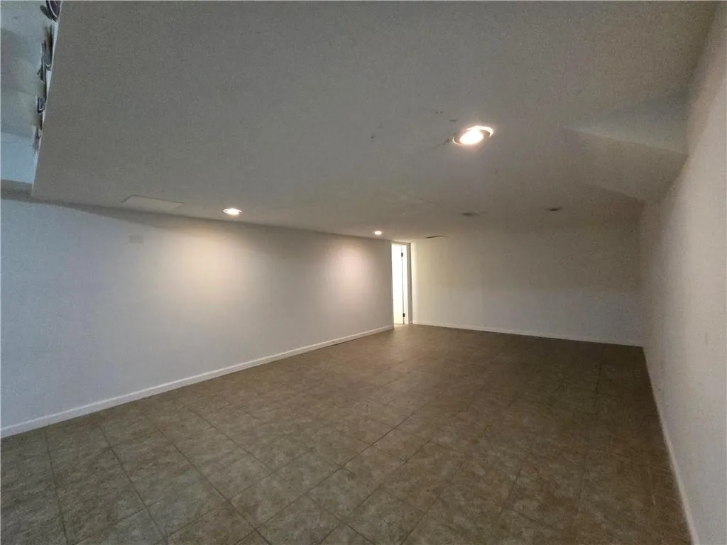 Spare room with recessed lighting and tile floor