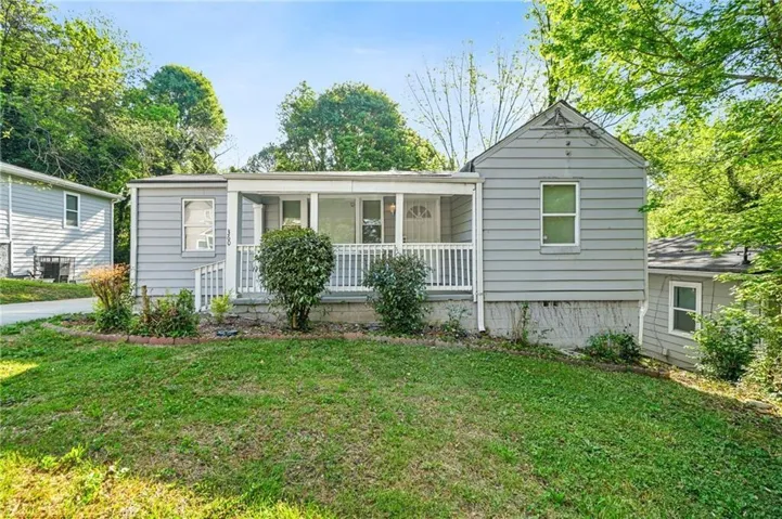 Gray siding exterior with white trim