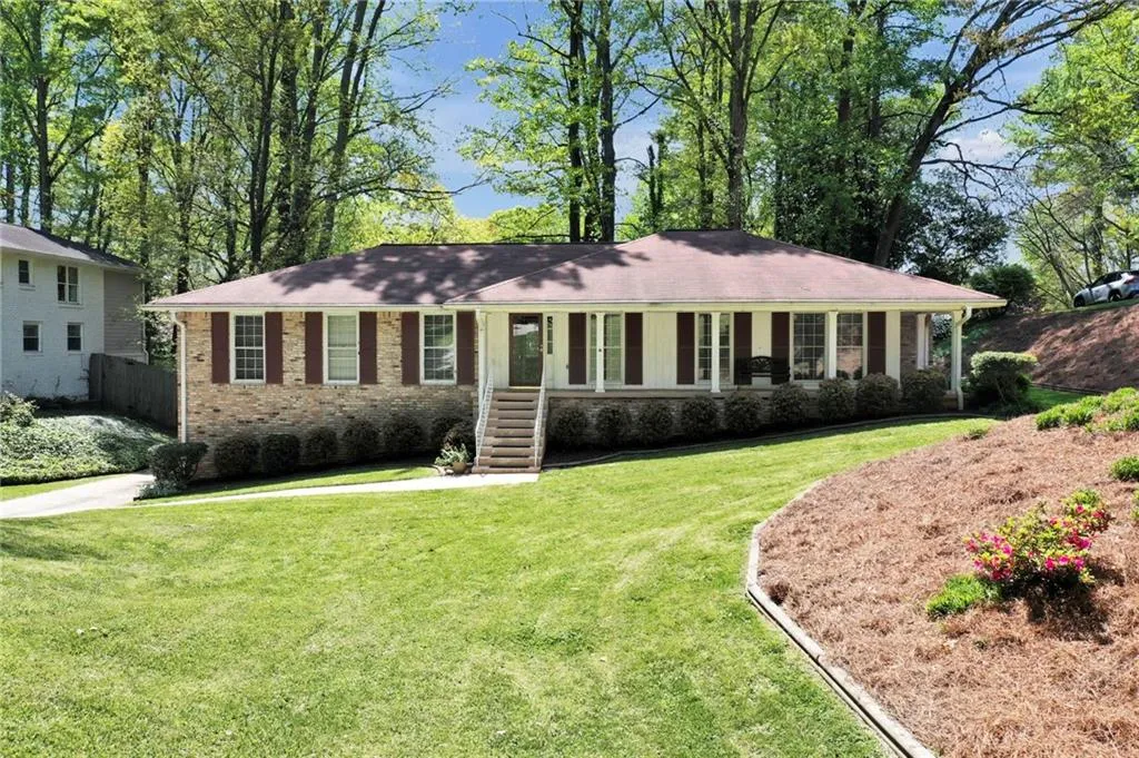 Ranch-style house with a front lawn