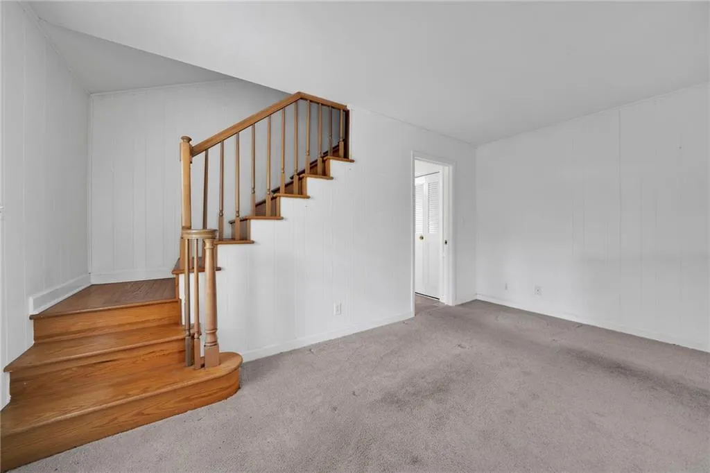 Stairs leading to unfinished attic bonus space