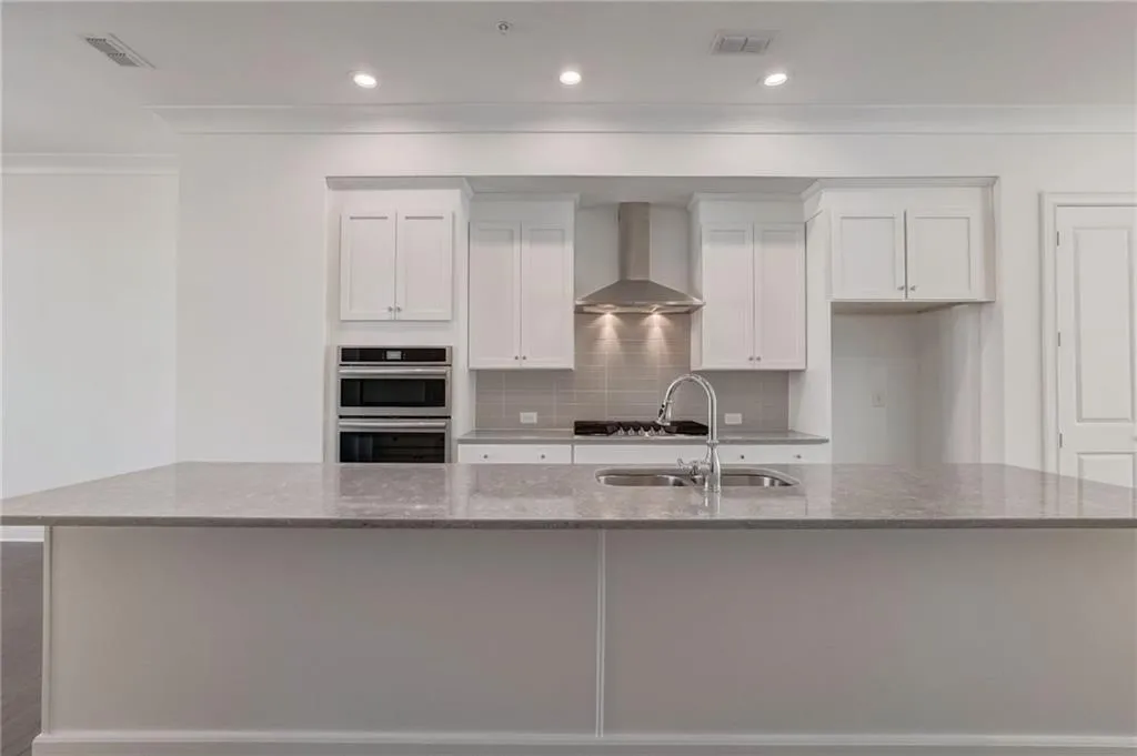 The chef will enjoy the central kitchen with 12 foot island.