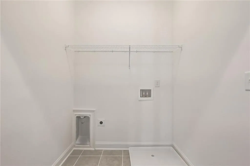 The utility room on upper level is located right off Primary Bedroom for efficiency.