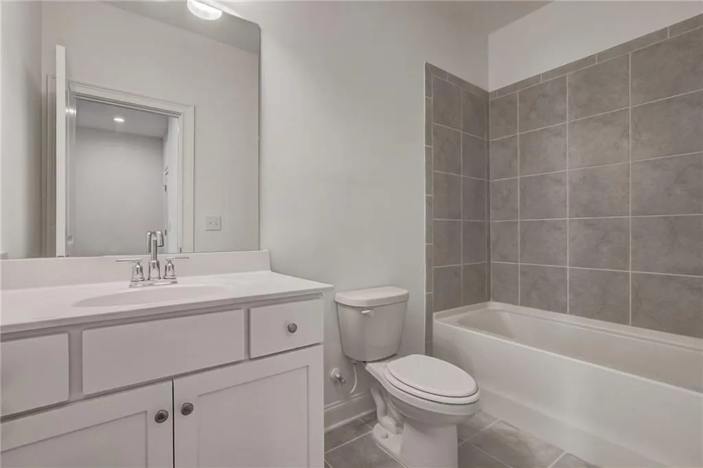 Private ensuite bathroom off upper level bedroom.