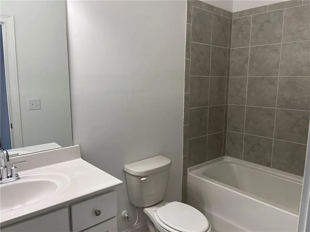 Full finished bath on basement level of this home.