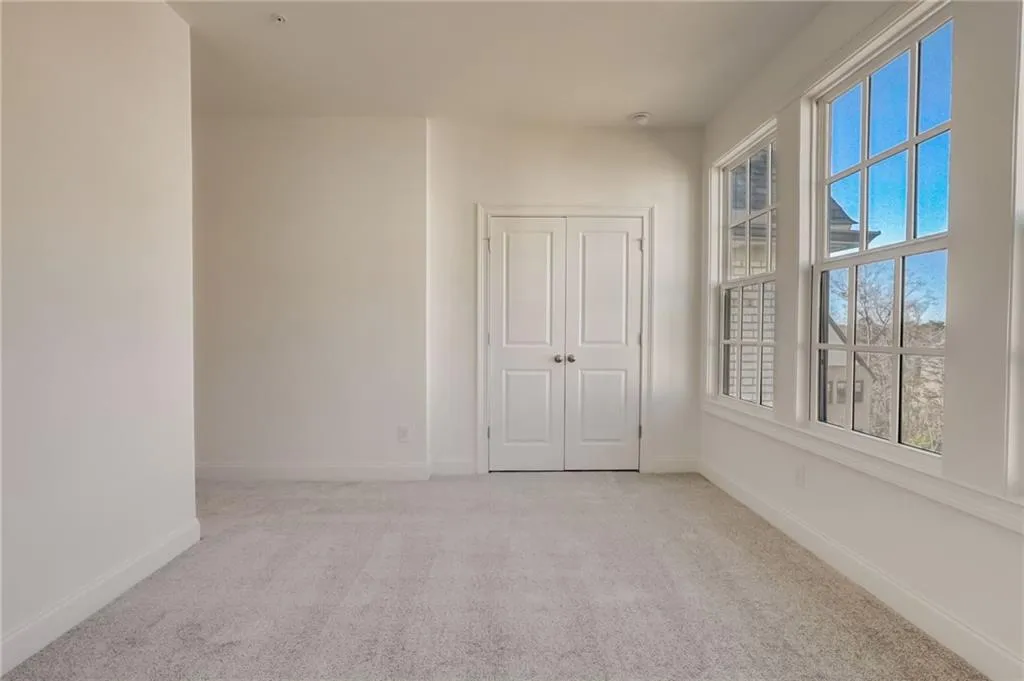 The upstairs guest suite overlooks the gorgeous greenspace.