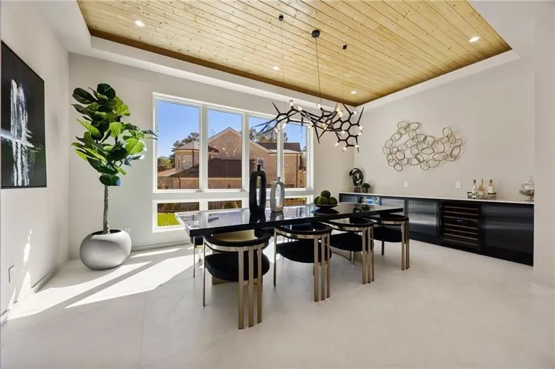 Dining room featuring a tray ceiling, wooden ceiling, wine cooler, and recessed lighting