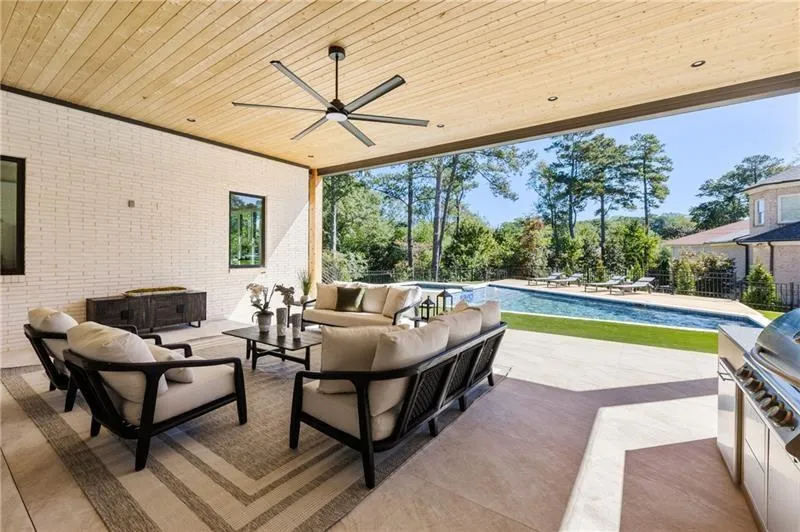View of patio / terrace featuring ceiling fan, outdoor lounge area, and exterior kitchen