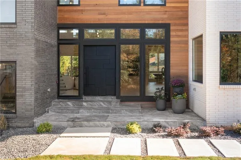 Entrance to property with brick siding